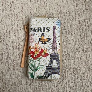 Paris themes wristlet or wallet. Lots of space for cards, cash and coins.